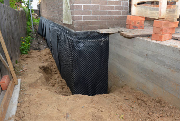 Happy homeowners after waterproofing job in Northville